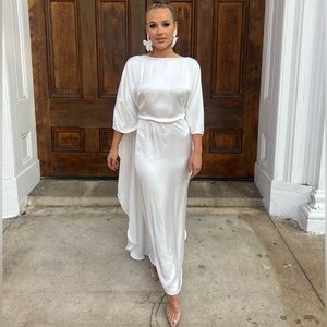 Erika Peña white cape dress